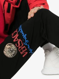 Versace pantalon de jogging à logo imprimé