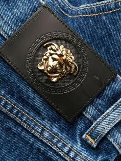 Versace jean bootcut à imprimé Greca
