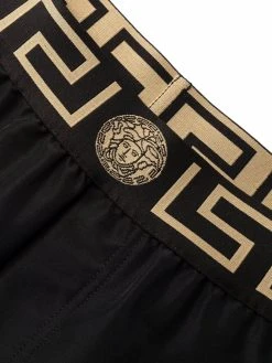 Versace short de bain à bordure Greca